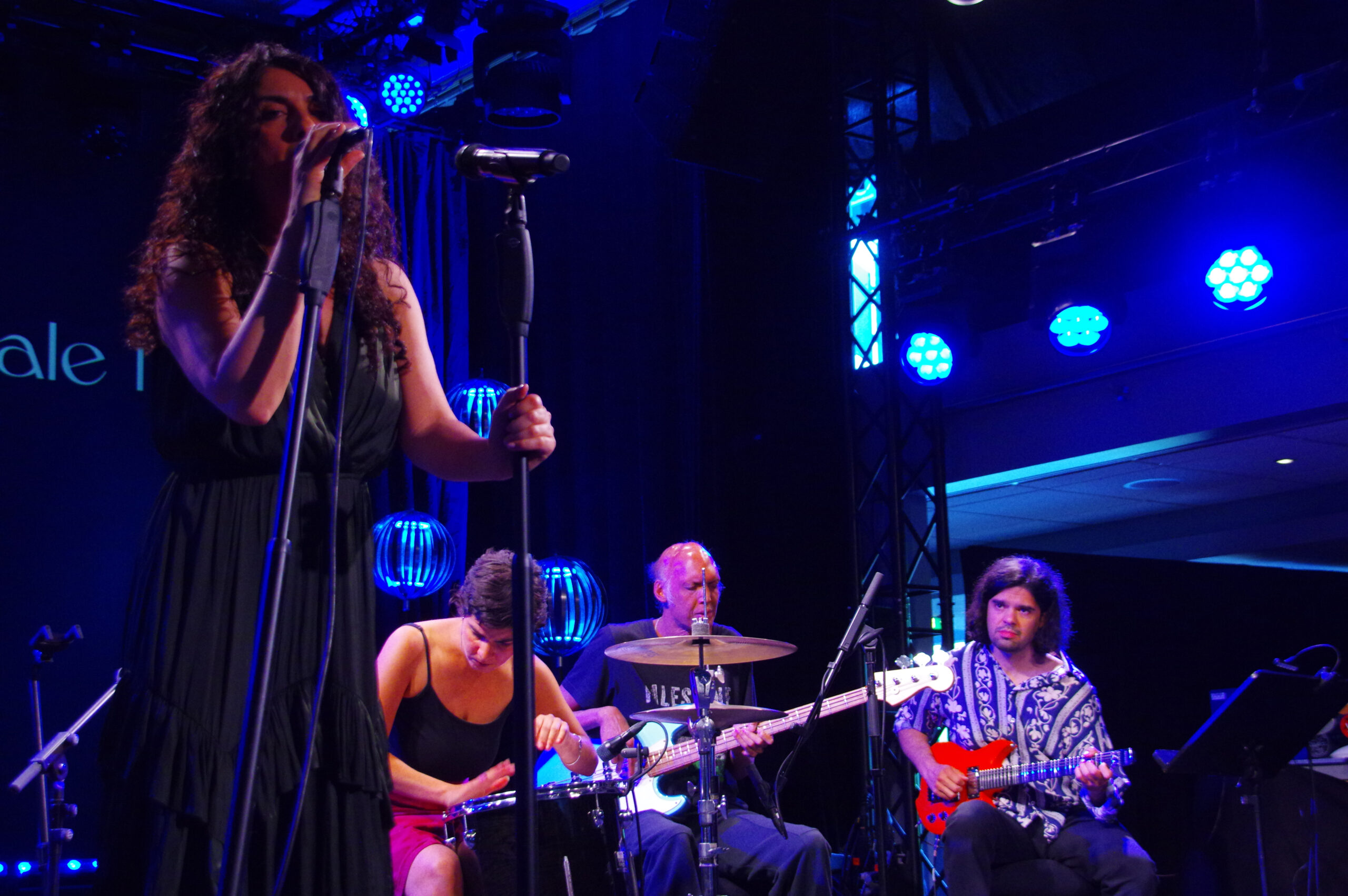 Vocalist/poet Haleh Gafori, Miriam Elhajli playing snare drum, Shazad Ismaily on bass guitar and guitarist Yousif Yaseen 