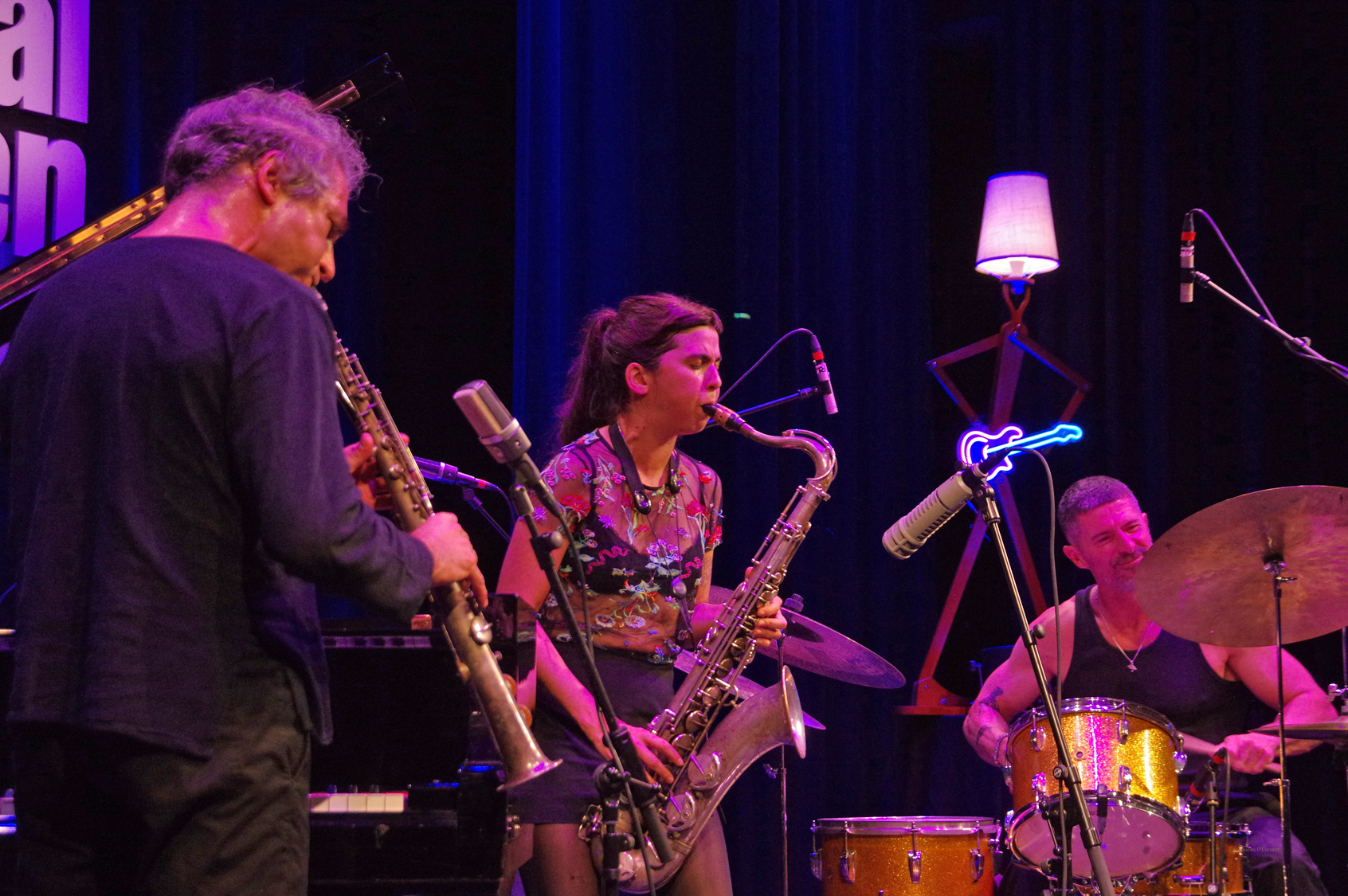 Leo Genovese playing soprano saxophone, tenor saxophonist Camila Nebbia, drummer Alfred Vogel