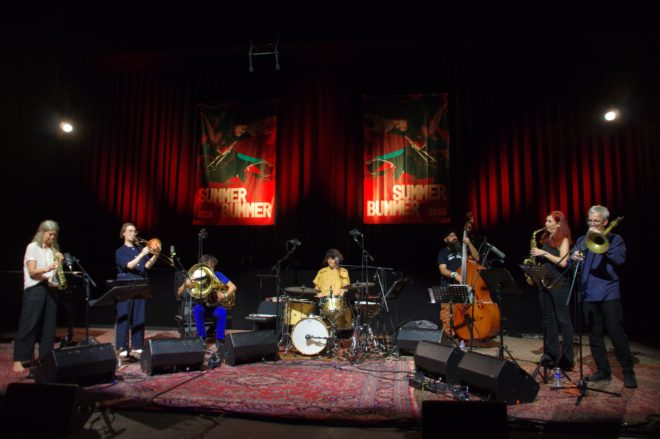 Brazilian drummer Mariá Portugal (centre) with her Erosão Septeti